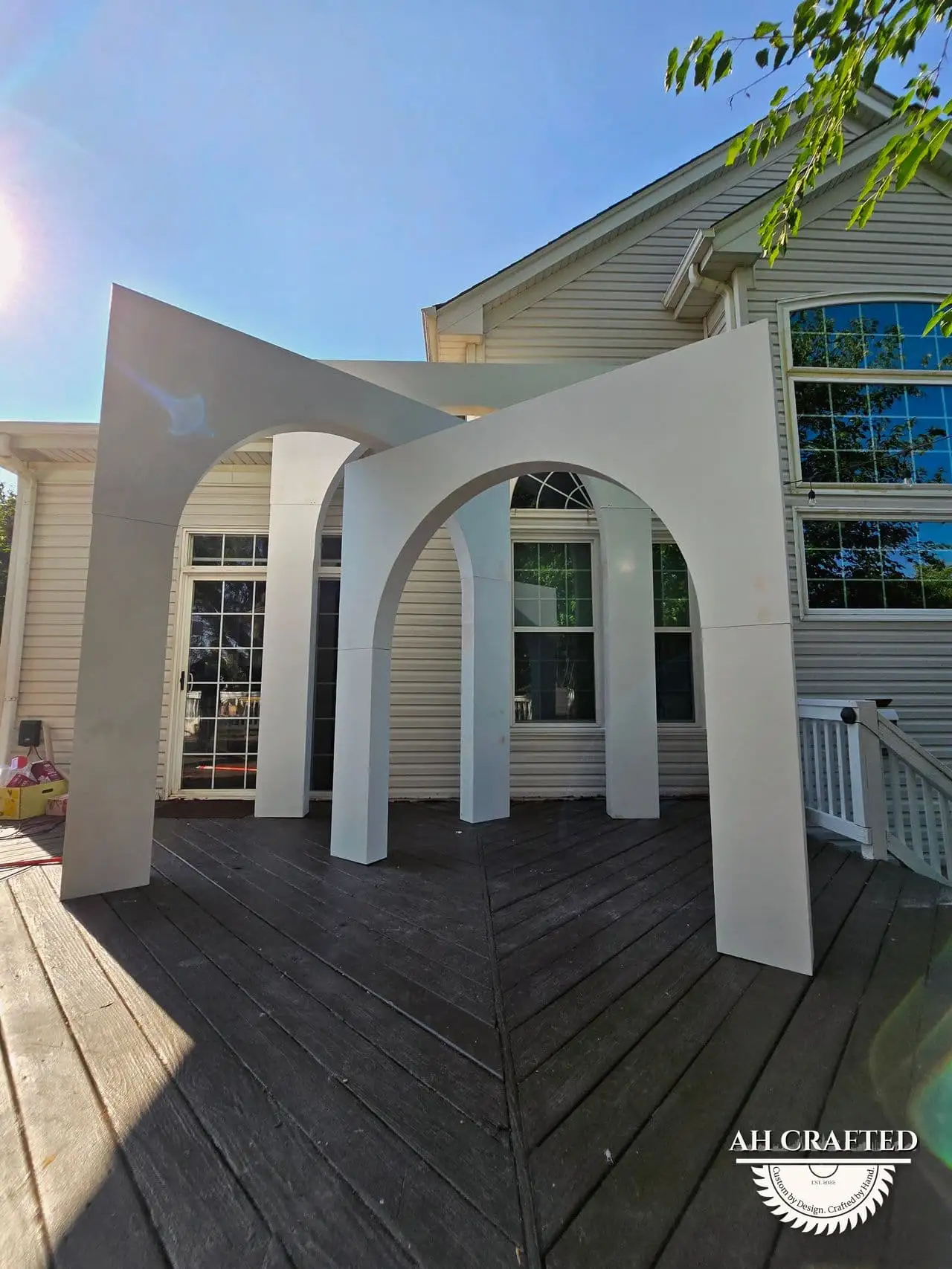 Volumetric Arc Suite — a custom sculptural backdrop built by AH Crafted.