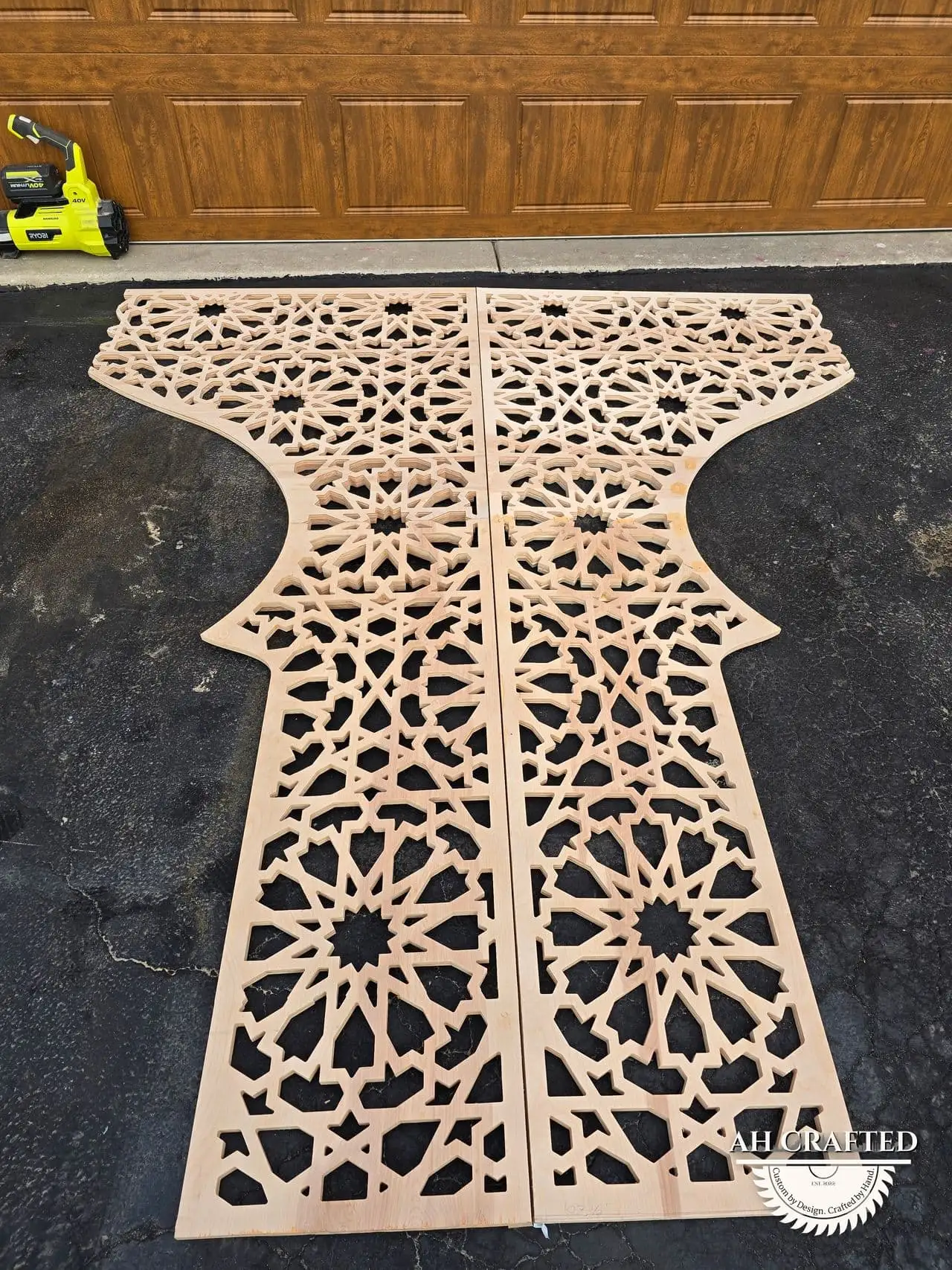 Rani Matrix Arch — rani-pink CNC cutout boxed panels forming a mihrab arch, built by AH Crafted.