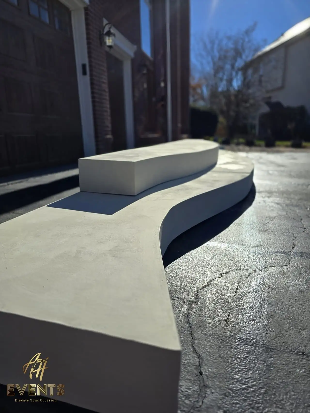 Classical Pillar Arch & Stage — a custom arch & contoured stage built by AH Crafted.