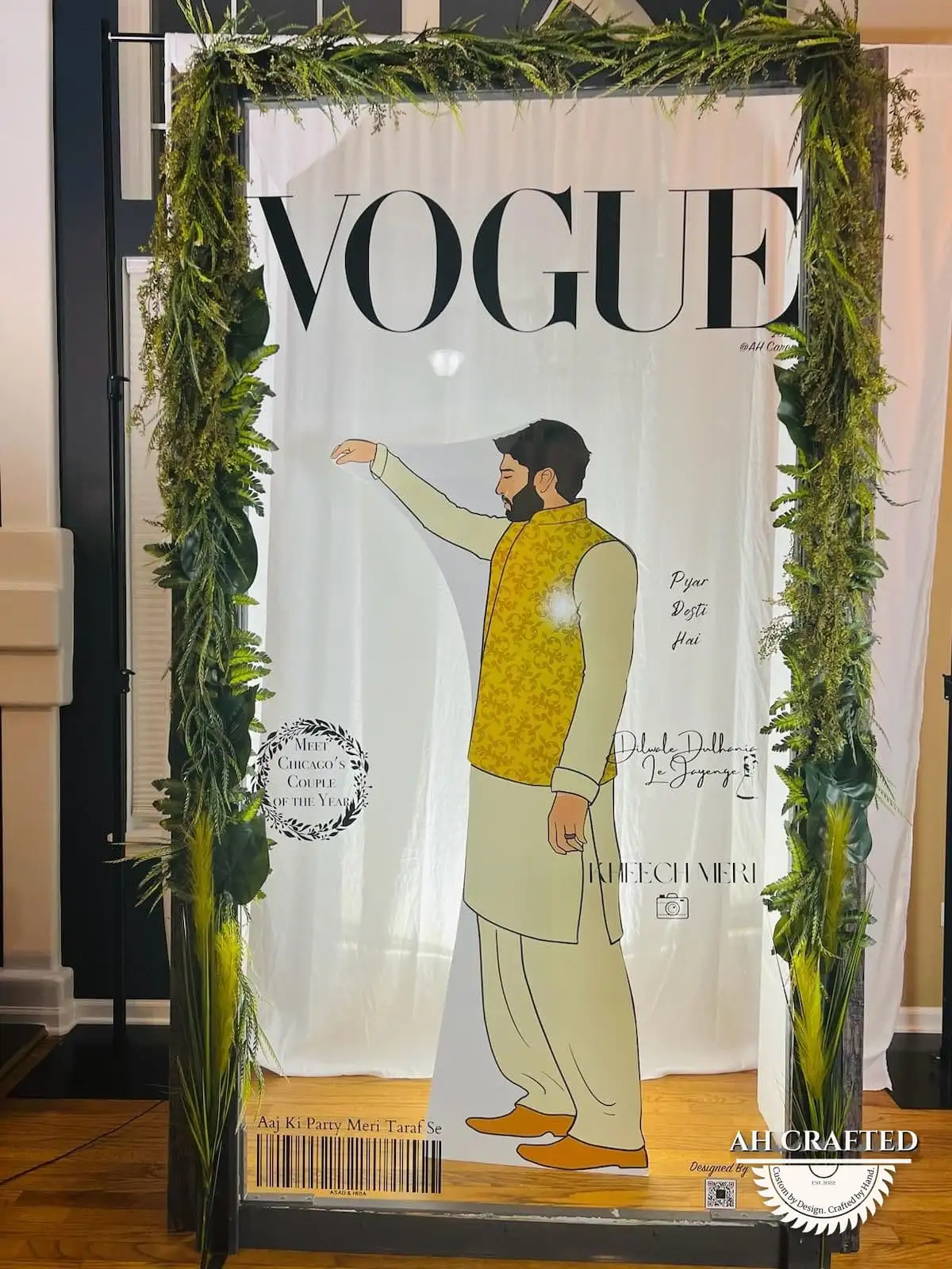 Photo Booth — a Vogue-style magazine-cover photo frame in black with green florals, built by AH Crafted.
