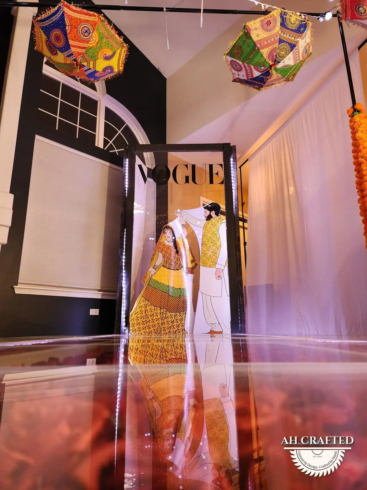 Photo Booth — a Vogue-style magazine-cover photo frame in black with green florals, built by AH Crafted.