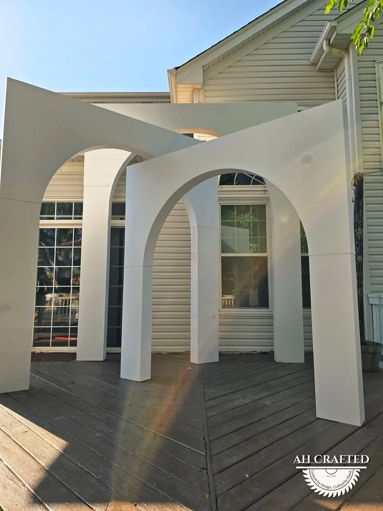 Volumetric Arc Suite — a custom sculptural backdrop built by AH Crafted.