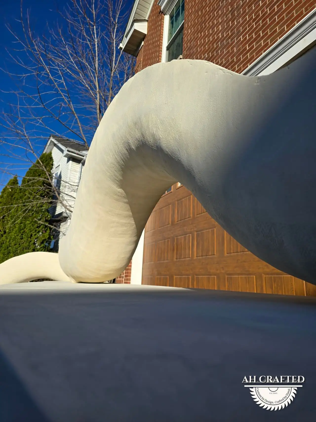 Classical Pillar Arch & Stage — a custom arch & contoured stage built by AH Crafted.