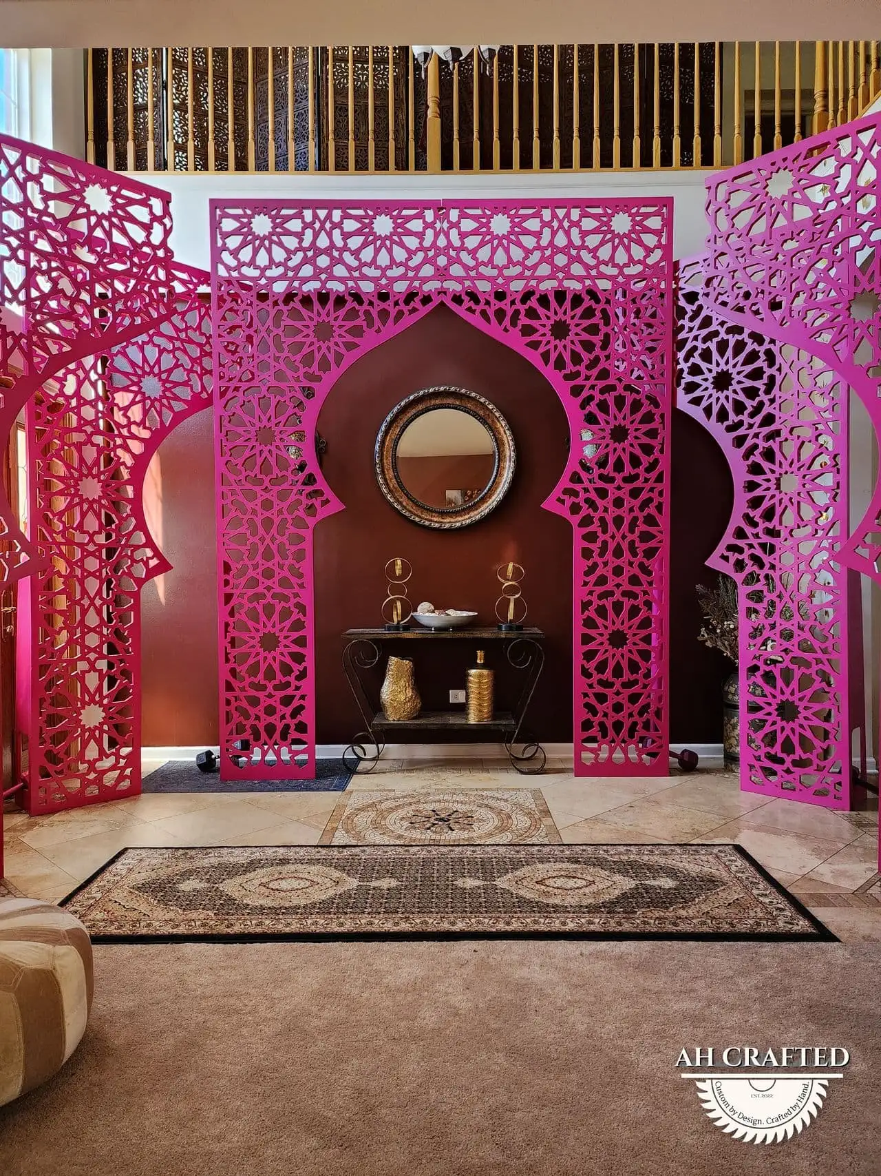 Rani Matrix Arch — rani-pink CNC cutout boxed panels forming a mihrab arch, built by AH Crafted.