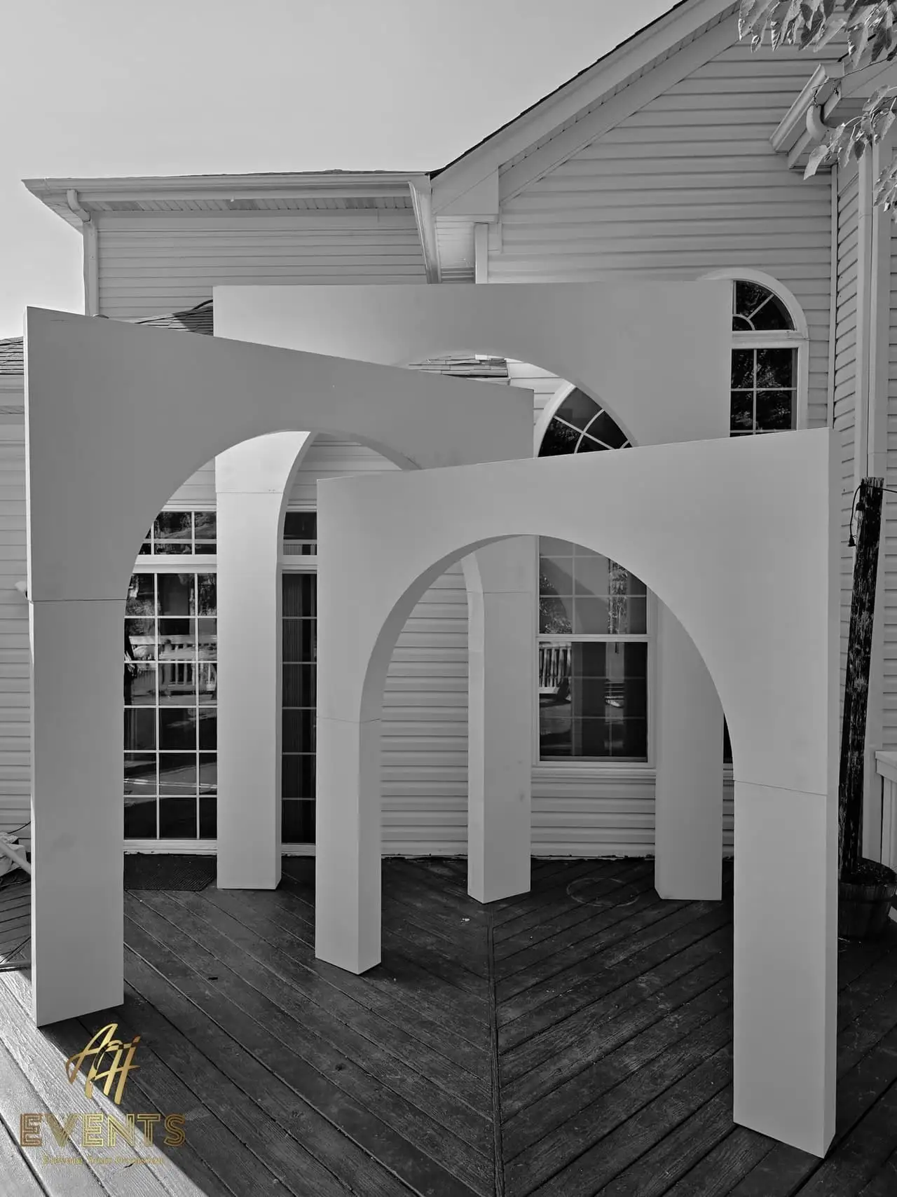 Volumetric Arc Suite — a custom sculptural backdrop built by AH Crafted.