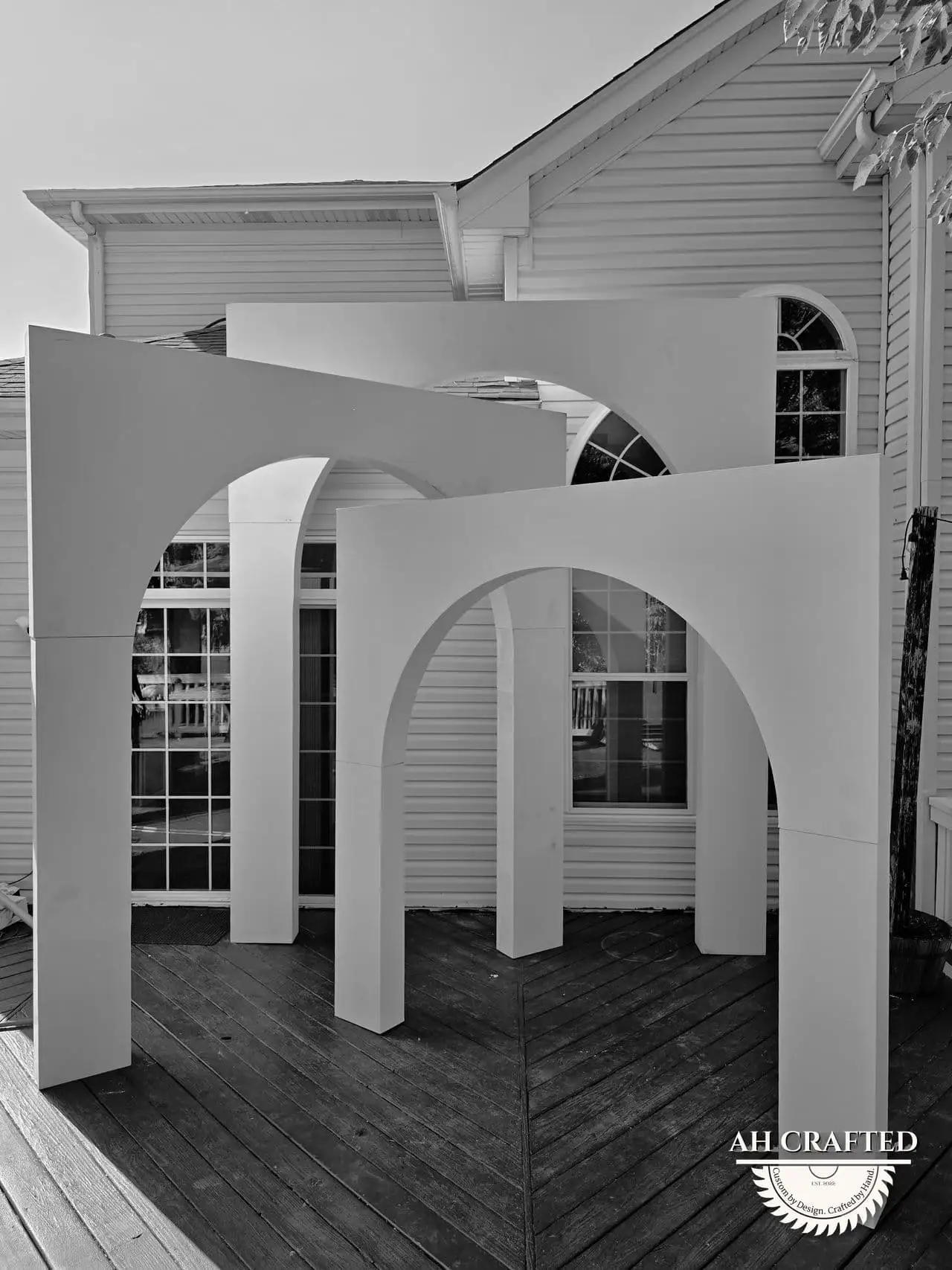 Volumetric Arc Suite — a custom sculptural backdrop built by AH Crafted.
