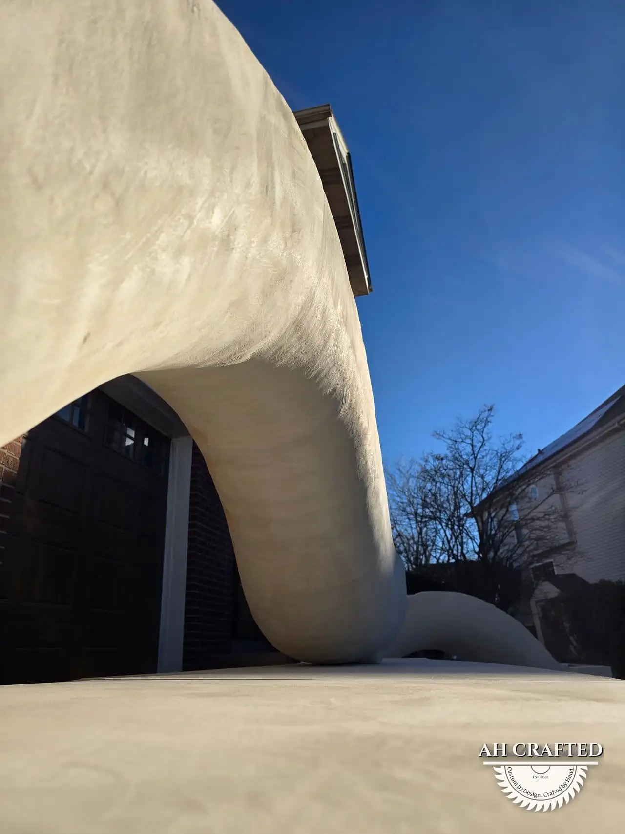 Classical Pillar Arch & Stage — a custom arch & contoured stage built by AH Crafted.