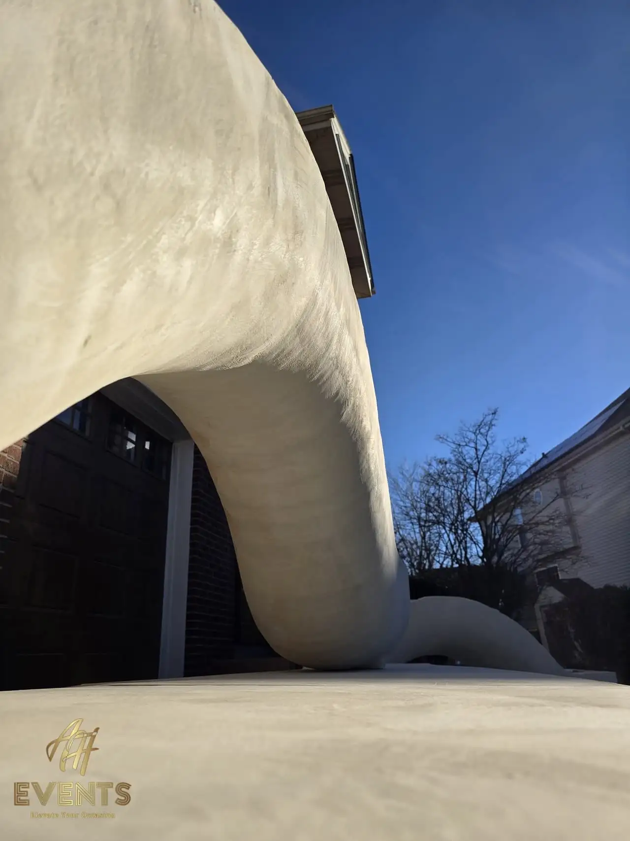Classical Pillar Arch & Stage — a custom arch & contoured stage built by AH Crafted.