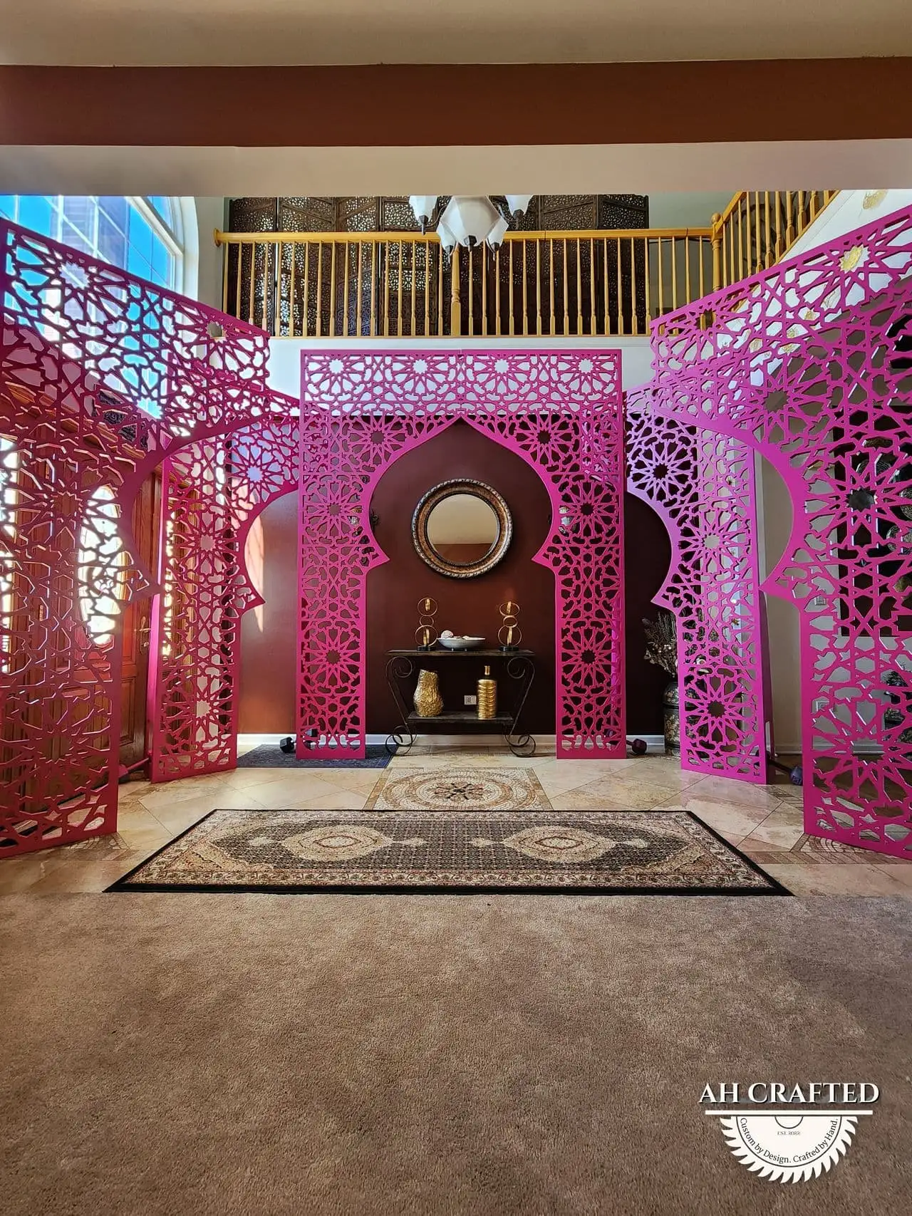 Rani Matrix Arch — rani-pink CNC cutout boxed panels forming a mihrab arch, built by AH Crafted.