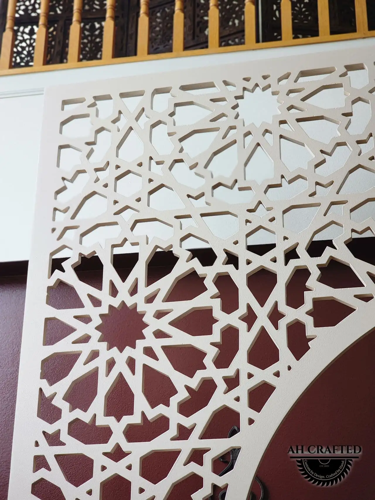 Pearl Matrix Arch — soft-cream CNC cutout boxed panels forming a mihrab arch, built by AH Crafted.
