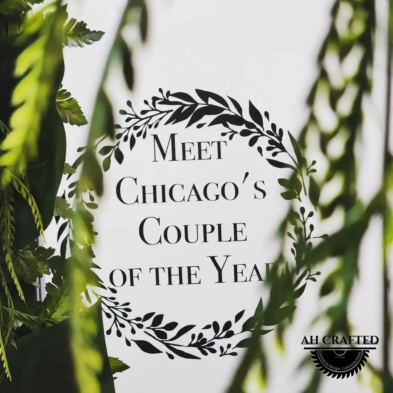 Photo Booth — a Vogue-style magazine-cover photo frame in black with green florals, built by AH Crafted.