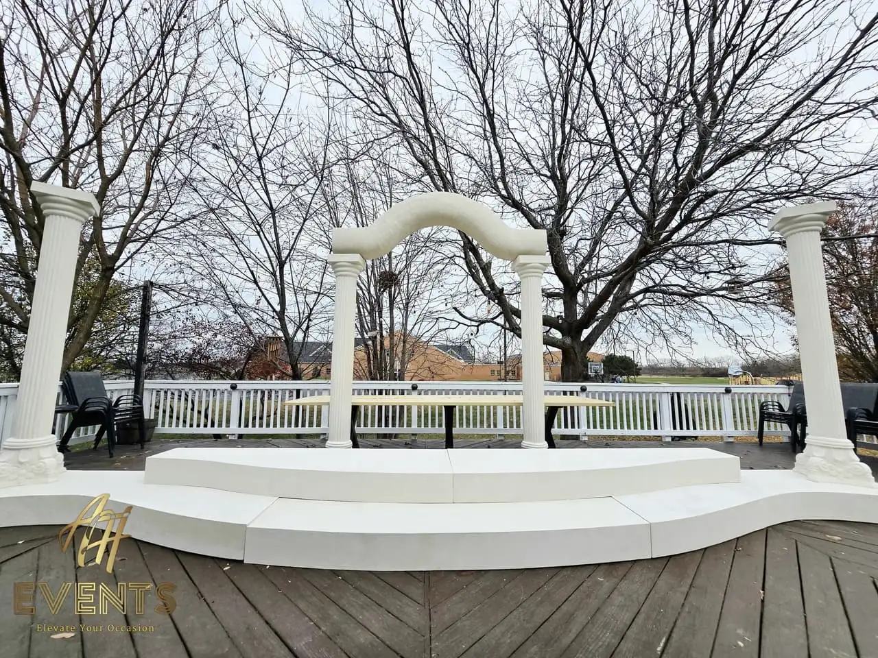 Classical Pillar Arch & Stage — a custom arch & contoured stage built by AH Crafted.