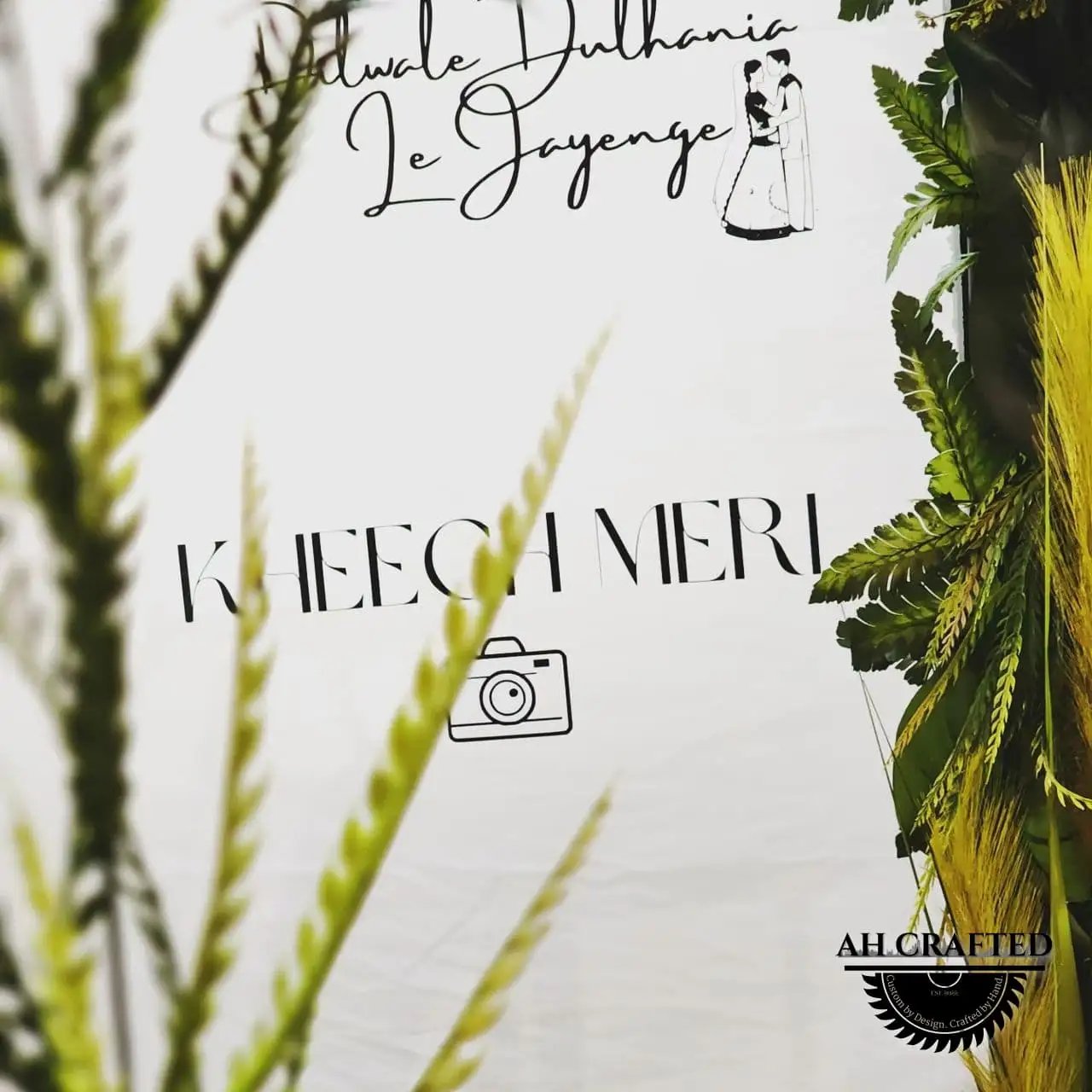 Photo Booth — a Vogue-style magazine-cover photo frame in black with green florals, built by AH Crafted.