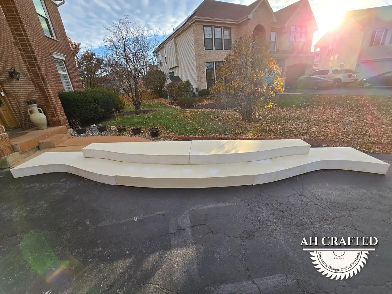 Classical Pillar Arch & Stage — a custom arch & contoured stage built by AH Crafted.