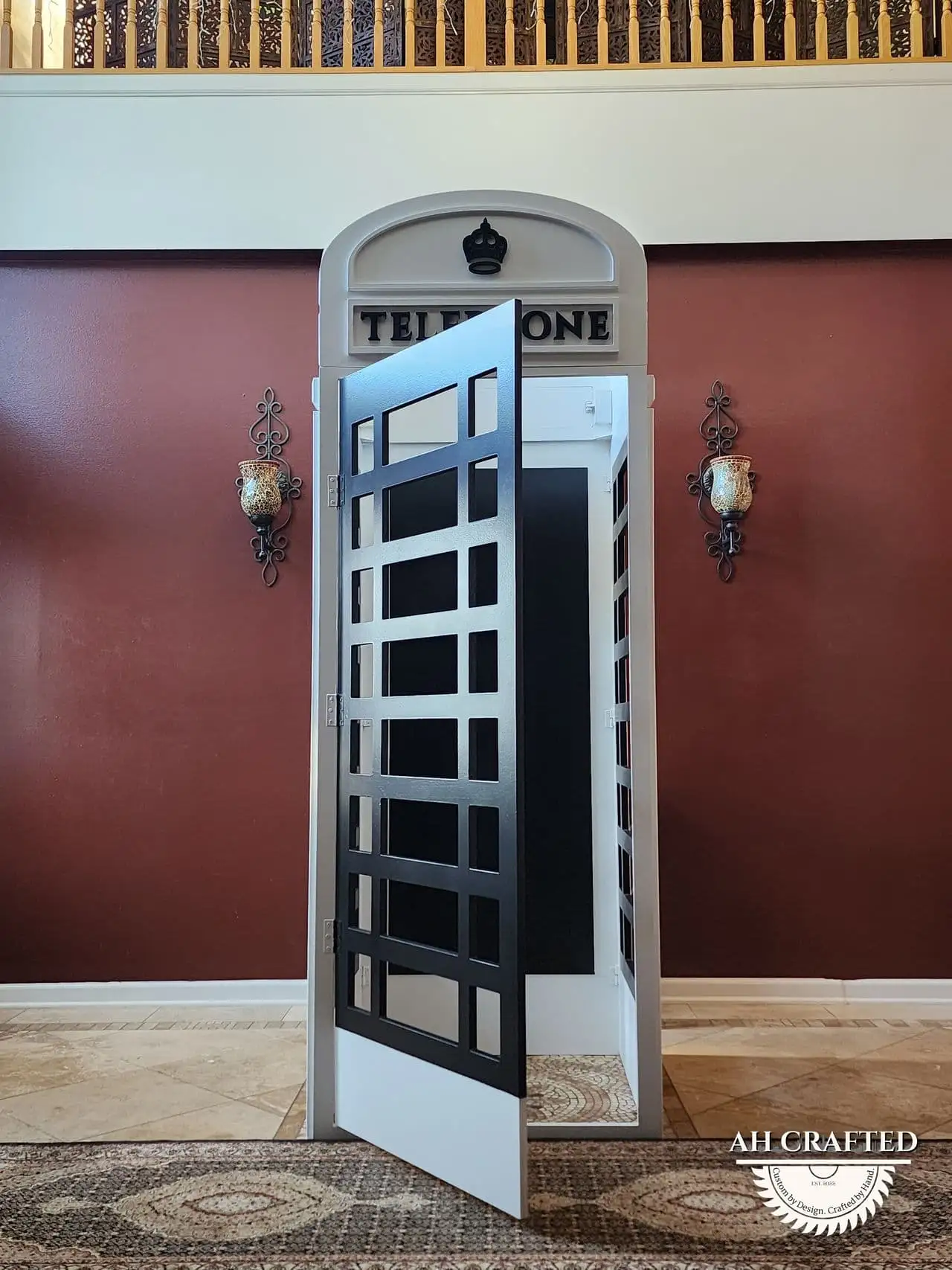 The booth with its door swung open, showing the walk-in interior.