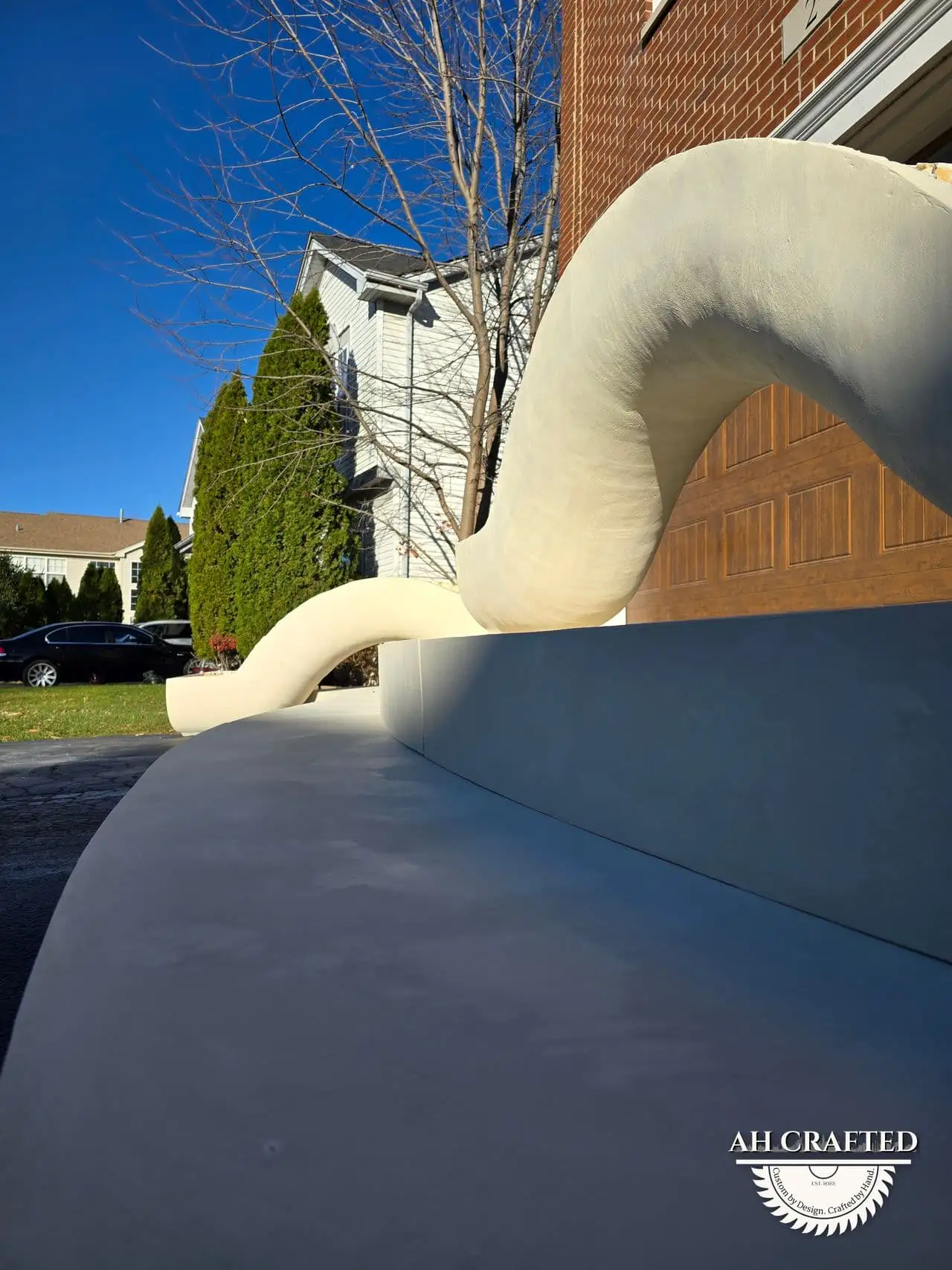 Classical Pillar Arch & Stage — a custom arch & contoured stage built by AH Crafted.