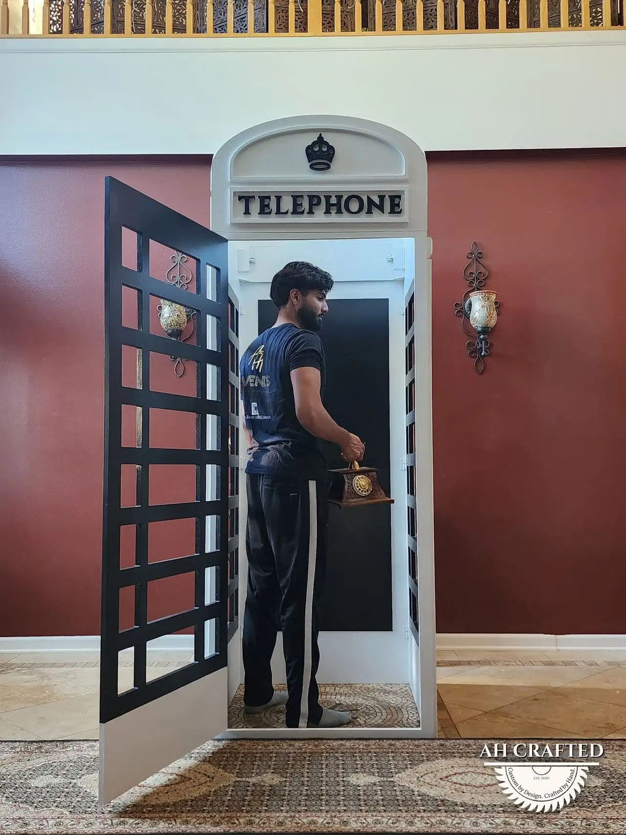 A person standing inside the booth, showing its full seven-and-a-half-foot height.