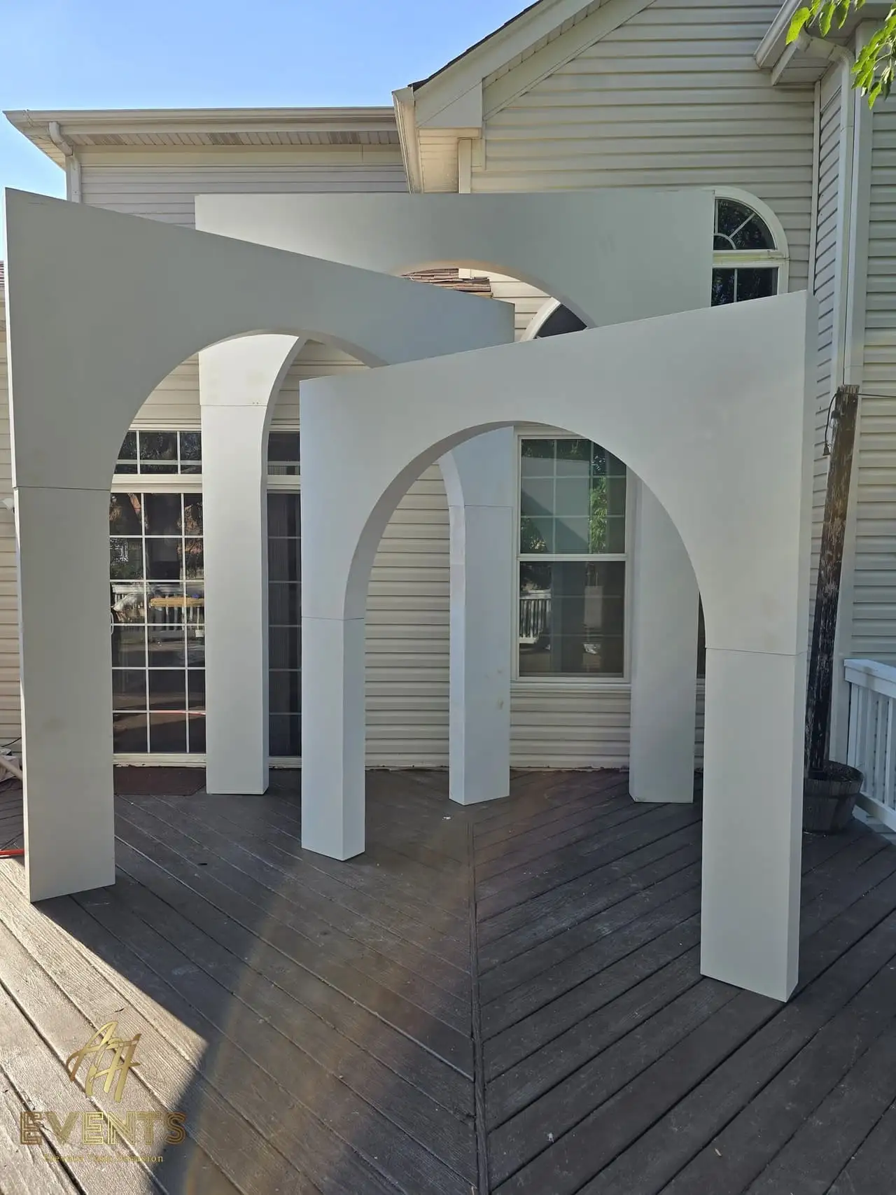 Volumetric Arc Suite — a custom sculptural backdrop built by AH Crafted.