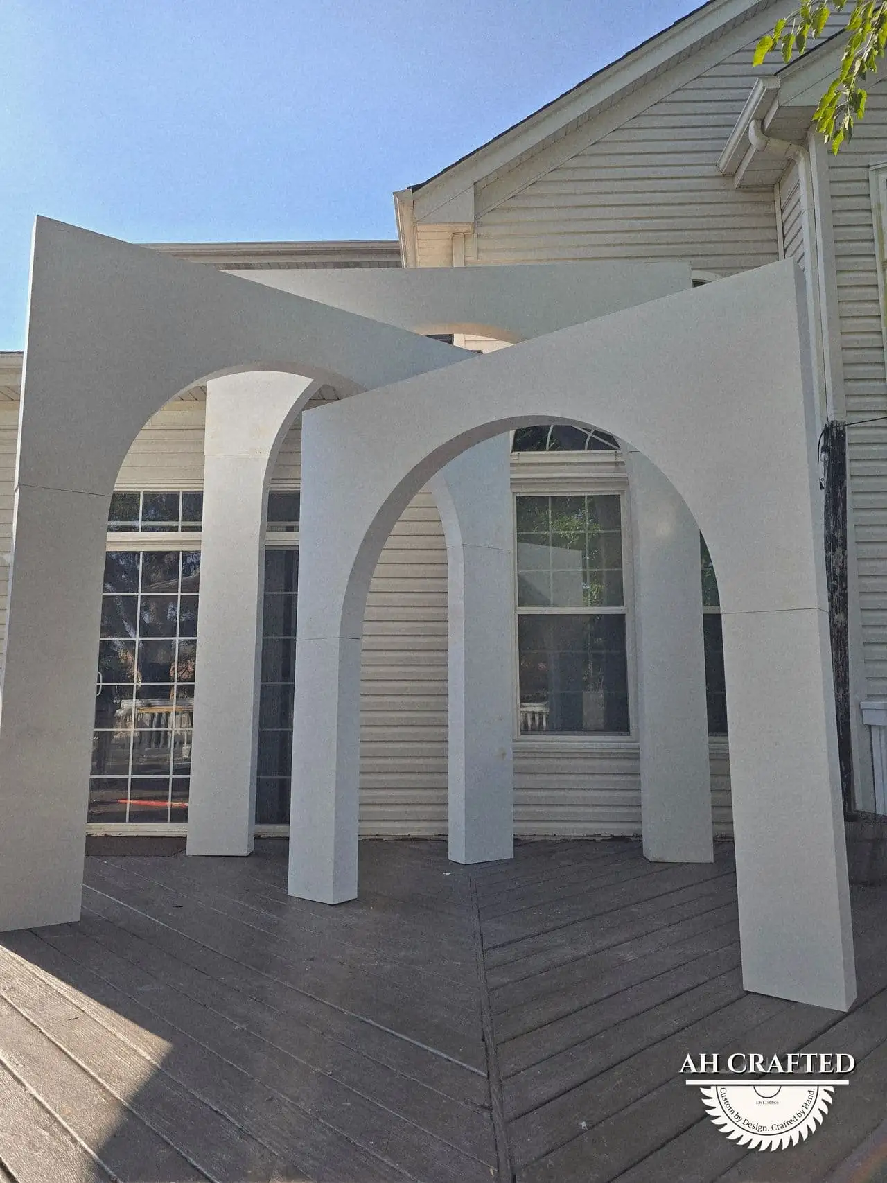Volumetric Arc Suite — a custom sculptural backdrop built by AH Crafted.