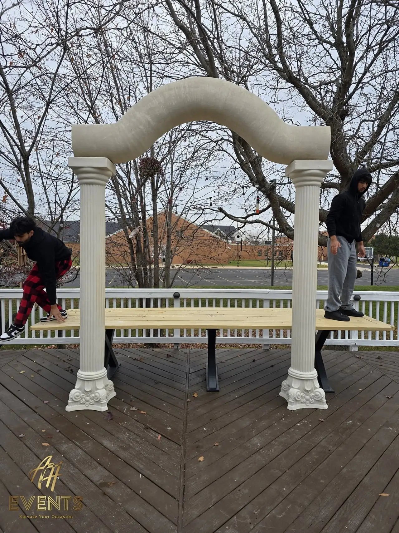 Classical Pillar Arch & Stage — a custom arch & contoured stage built by AH Crafted.
