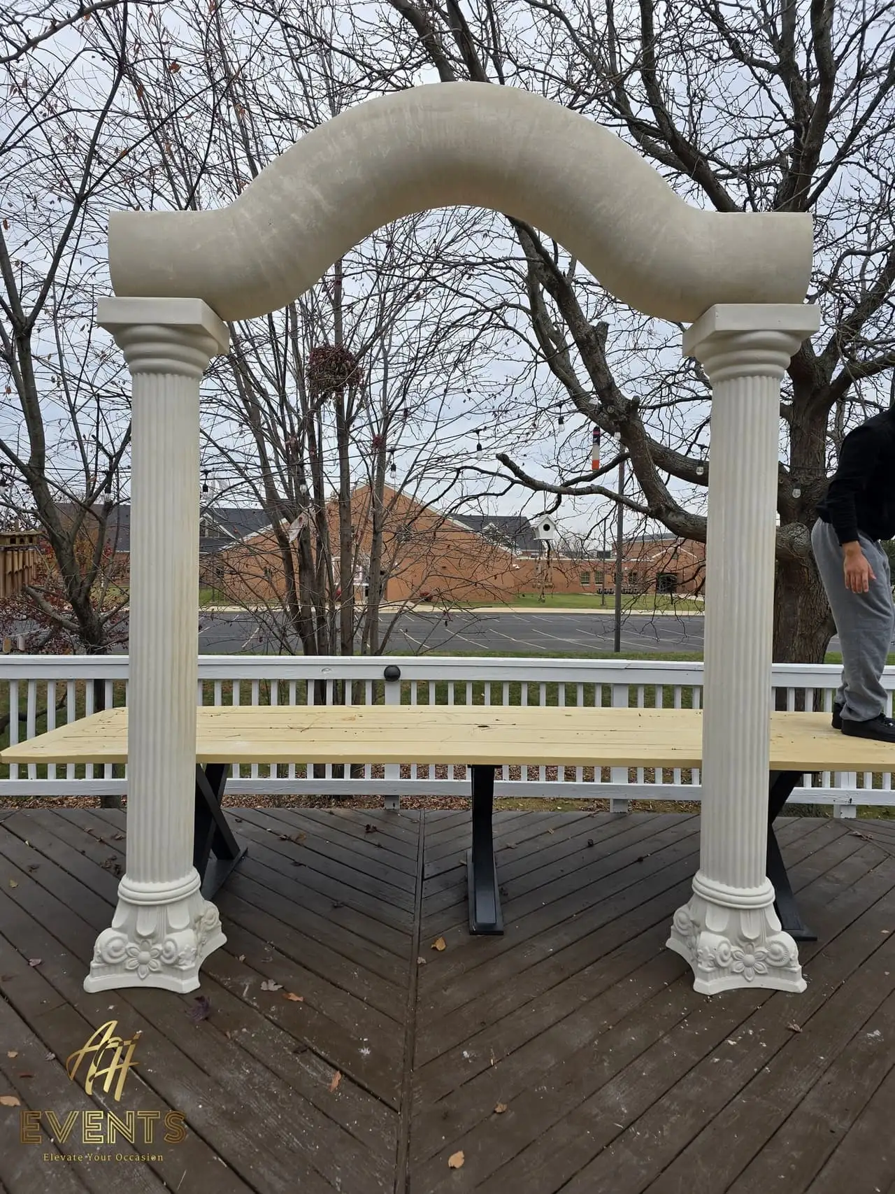 Classical Pillar Arch & Stage — a custom arch & contoured stage built by AH Crafted.