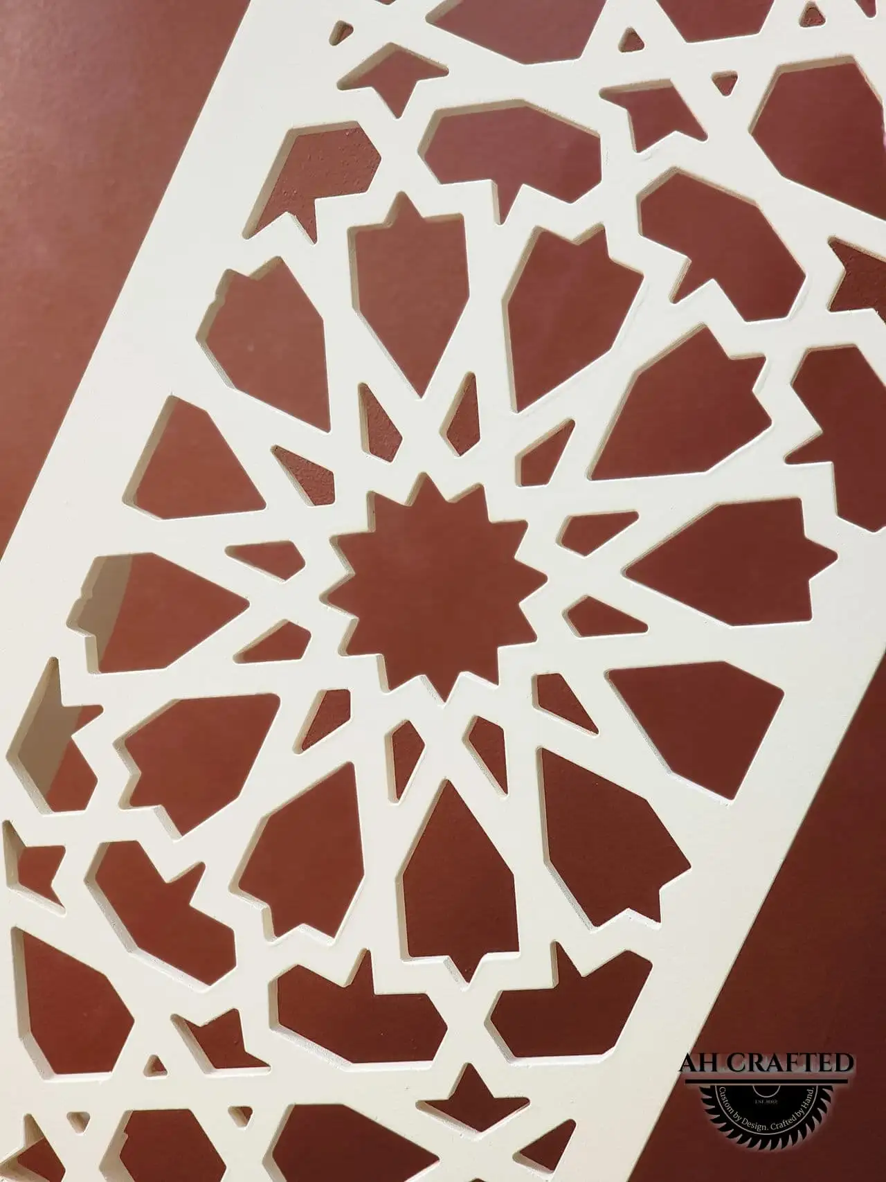 Pearl Matrix Arch — soft-cream CNC cutout boxed panels forming a mihrab arch, built by AH Crafted.
