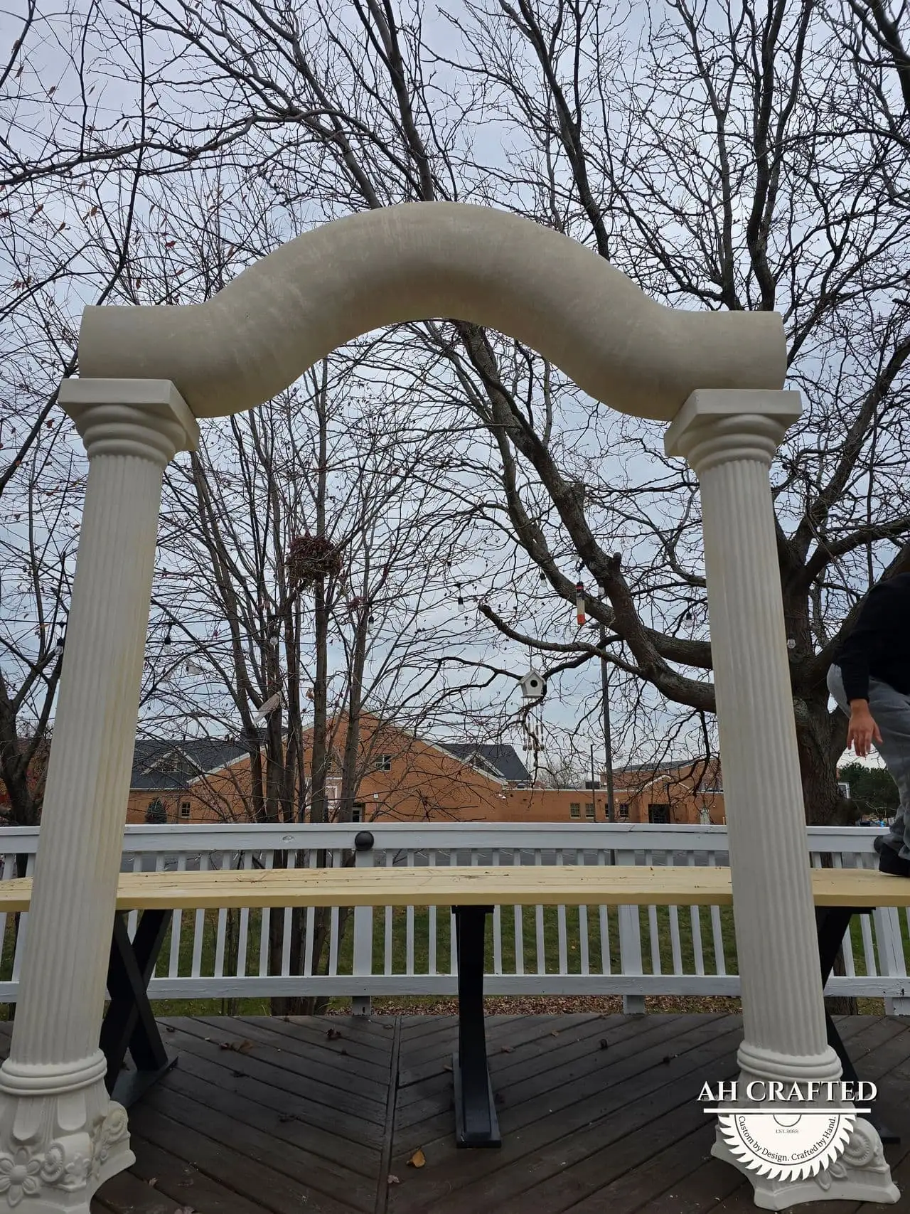Classical Pillar Arch & Stage — a custom arch & contoured stage built by AH Crafted.