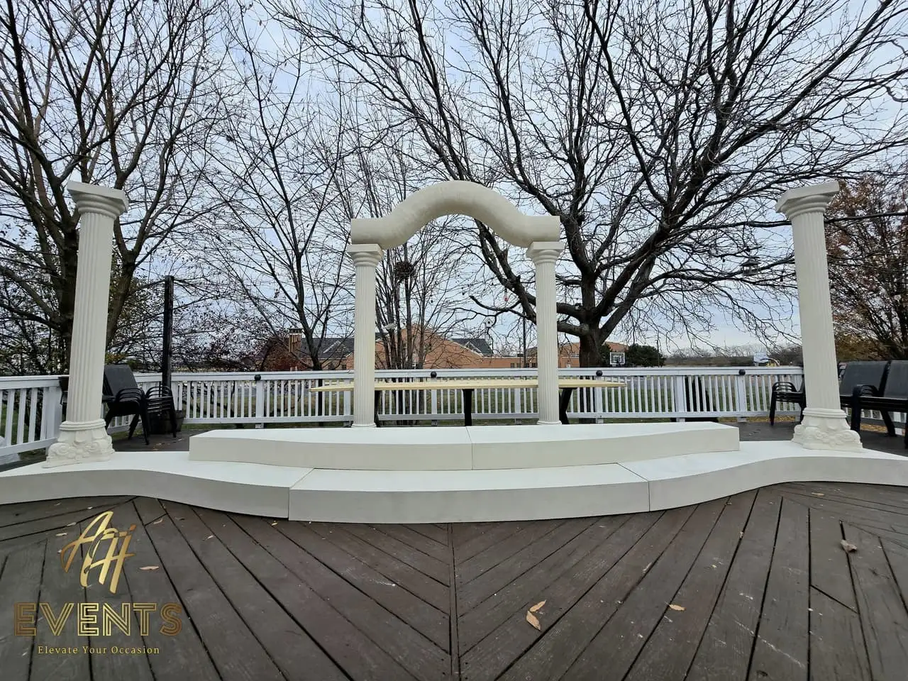 Classical Pillar Arch & Stage — a custom arch & contoured stage built by AH Crafted.